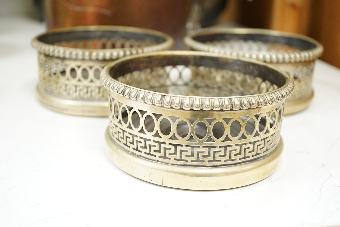 Three plated coasters, 13cm diameter